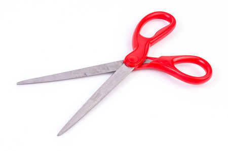 Red scissors on isolated white の写真素材