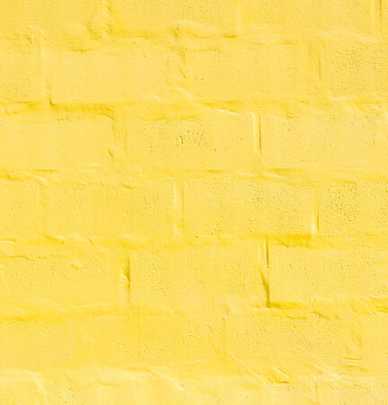 Old yellow wall texture backgroundの写真素材