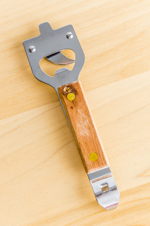 Can opener on wood backgroundの写真素材
