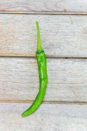 Chilli on wood backgroundの写真素材
