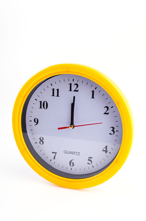 Yellow clock alarm isolated on white backgroundの写真素材