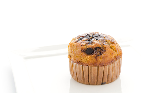 Chocolate muffin cake isolated on whiteの写真素材