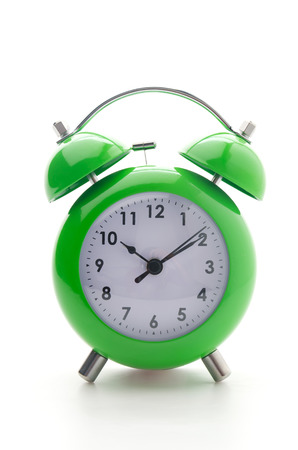 Green clock isolated on whiteの写真素材