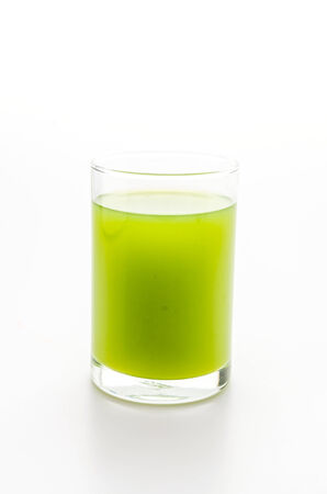 Kiwi juice glass isolated on whiteの写真素材
