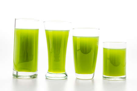 Kiwi juice glass isolated on whiteの写真素材