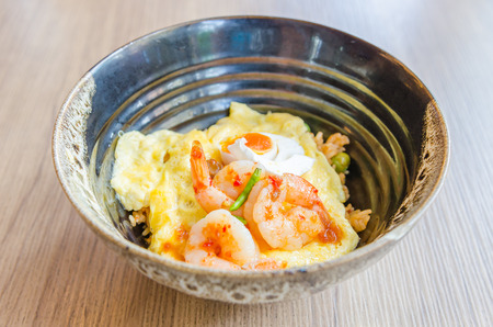 Omelette with fried rice chilli paste and shrimp on topの写真素材