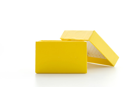 Yellow gift box isolated on whiteの写真素材