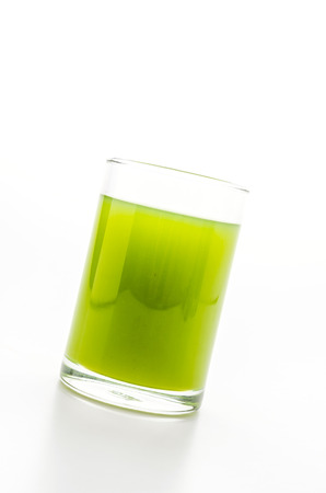 Kiwi juice glass isolated on whiteの写真素材