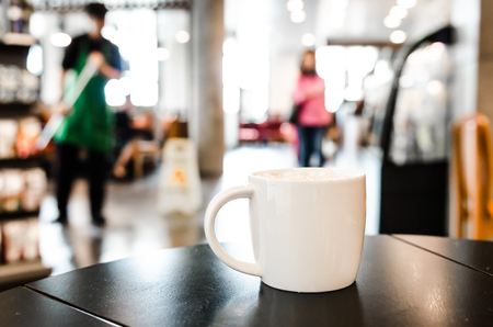 Coffee cup in coffee shop interiorの写真素材