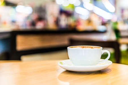Coffee cup in coffee shop interiorの写真素材