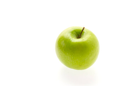 Green apple isolated on whiteの写真素材