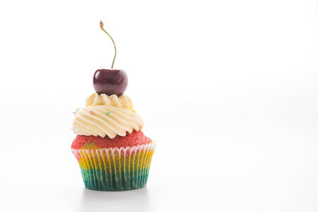 Cherry Cupcakes isolated on whiteの写真素材