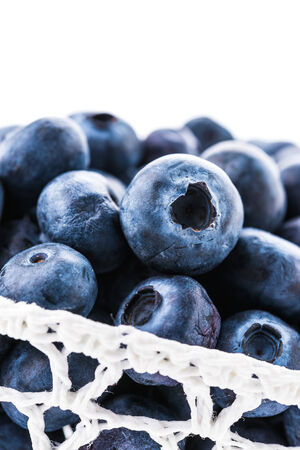 Blueberry basket isolated on whiteの写真素材