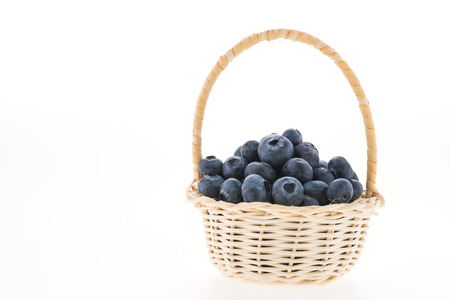 Blueberry basket isolated on whiteの写真素材