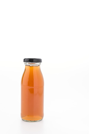 Apple juice bottle isolated on white backgroundの写真素材