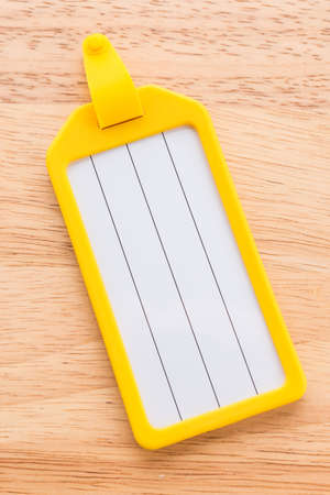 Tag luggage bag on wooden backgroundの写真素材