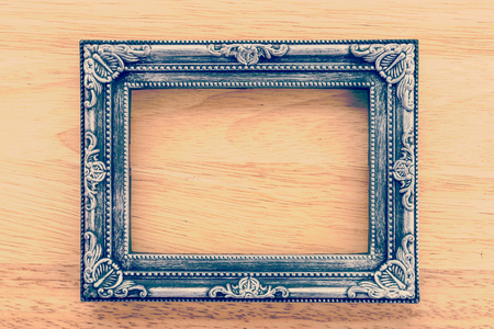 Vintage frame on wooden background process vintage style pictureの写真素材