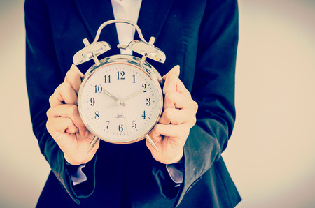 Clock on bussiness hand process vintage effect style pictureの写真素材