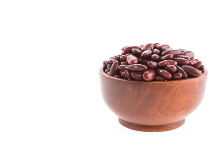 Red beans on wooden bowl isolated on white backgroundの写真素材