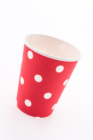 Red polka dot paper cup isolated on white backgroundの写真素材