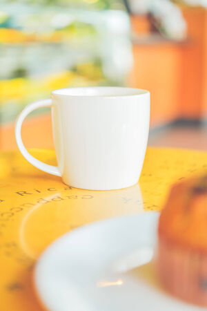 Coffee cup in coffee shop - vintage effect style picturesの写真素材