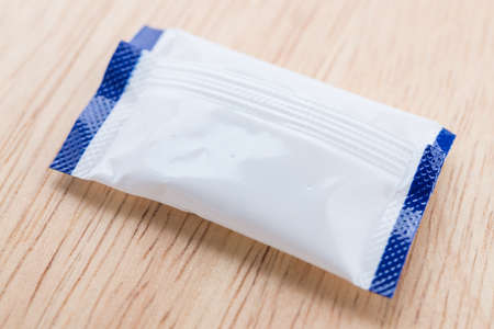 Sugar bag on wood backgroundの写真素材