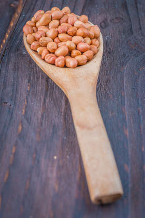 Peanut on wooden background - vintage effect style picturesの写真素材