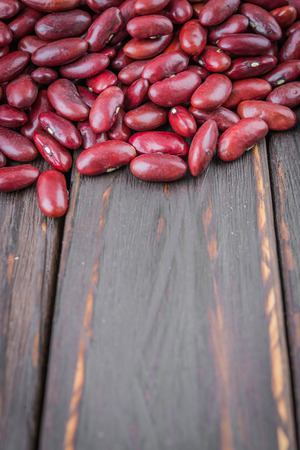 Red beans on wooden background - film effect style picturesの写真素材