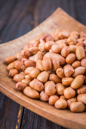 Peanut on wooden background - vintage effect style pictures
