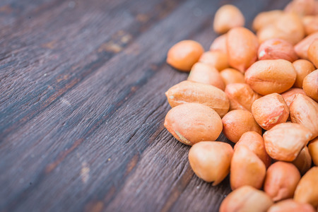 Peanut on wooden background - vintage effect style picturesの写真素材