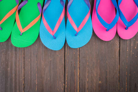 Slipper on wooden background - vintage effect style picturesの写真素材