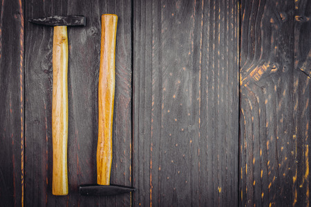 Hammer on wooden background - vintage effect style picutresの写真素材