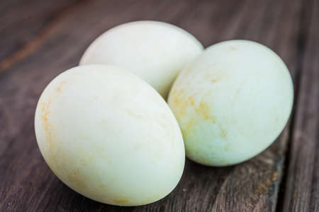 White egg on wooden backgroundの写真素材