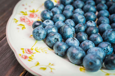 Blueberry dish on wooden background - dark effect pictures styleの写真素材