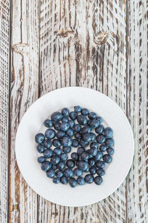 Blueberry dish on wooden backgroundの写真素材