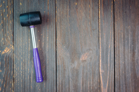 Hammer on wooden background - vintage effect style picutres