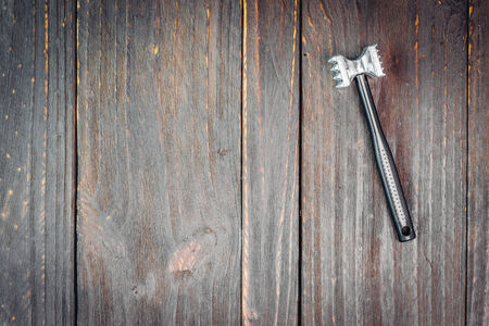 Hammer on wooden background - vintage effect style picutres