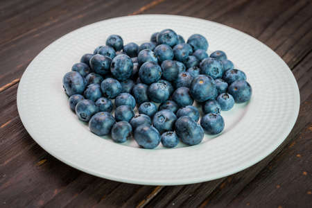 Blueberry dish on wooden background - dark effect pictures styleの写真素材