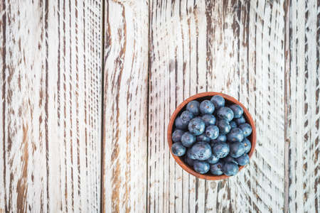blueberry bowl on wooden backgroundの写真素材