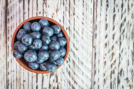 blueberry bowl on wooden backgroundの写真素材