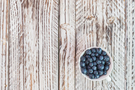 blueberry cup on wooden backgroundの写真素材