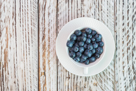 blueberry cup on wooden backgroundの写真素材