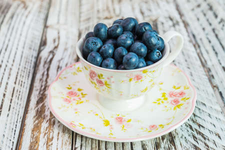 blueberry cup on wooden backgroundの写真素材