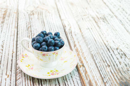 blueberry cup on wooden backgroundの写真素材