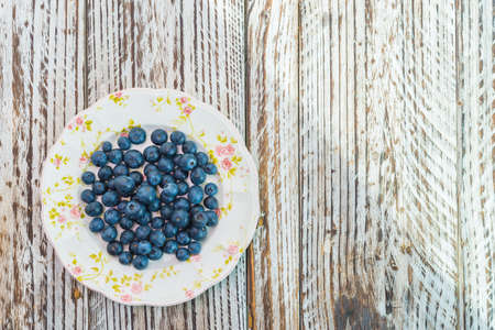 Blueberry dish on wooden backgroundの写真素材