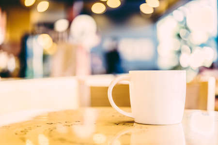 Coffee cup in coffee shop - vintage effect style picturesの写真素材