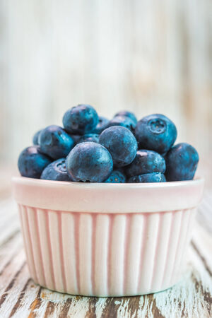Blueberry cup on wooden backgroundの写真素材