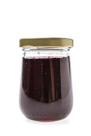 Blueberry jam jar isolated on white backgroundの写真素材