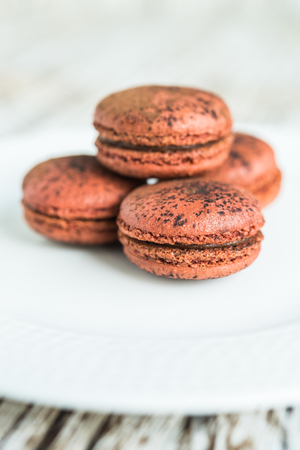 Chocolate macaroon on wooden backgroundの写真素材