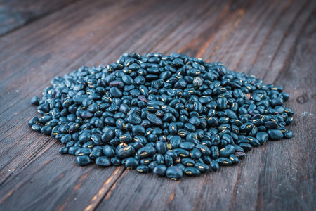 Black beans on wooden - vintage effect style picturesの写真素材